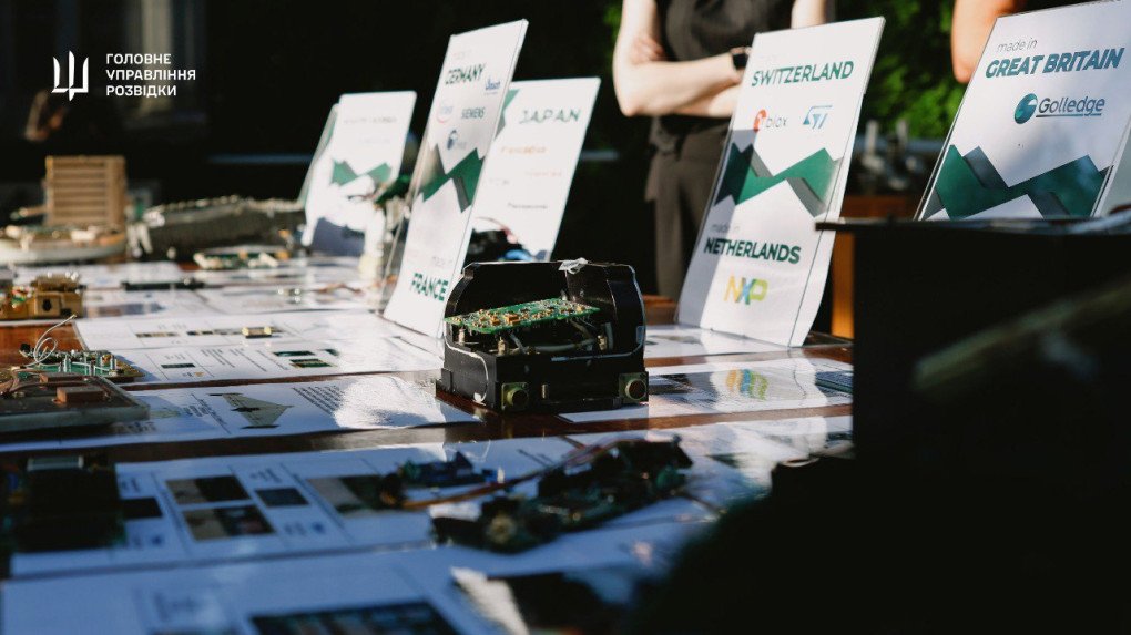 A table display showcases dismantled electronics from Russian weapons, with signage indicating Western manufacturers from France, Germany, Japan, and others. (Source: Main Intelligence Directorate) A table display showcases dismantled electronics from Russian weapons, with signage indicating Western manufacturers from France, Germany, Japan, and others. (Source: Main Intelligence Directorate)