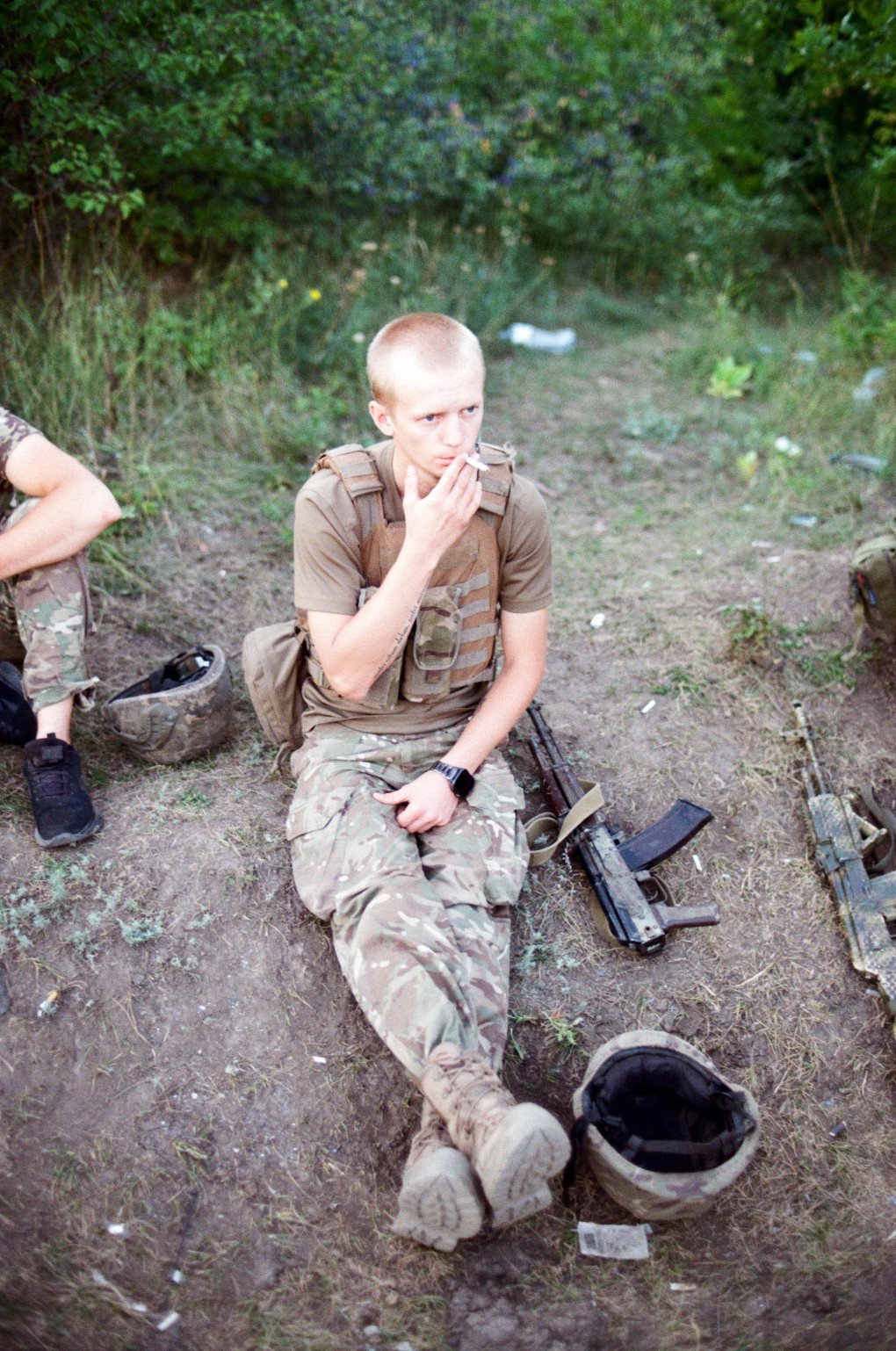 A soldier waits to be taken to positions, where he will spend 4 to 5 days. Ukraine, August 2025. Photo by Lucile Brizard/UNITED24 Media.