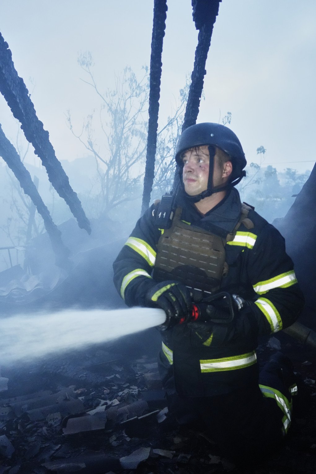 Firefighter during the aftermath of a Russian combined drone and missile strike on Kyiv on July 10, 2025. Photo: Josh Olley