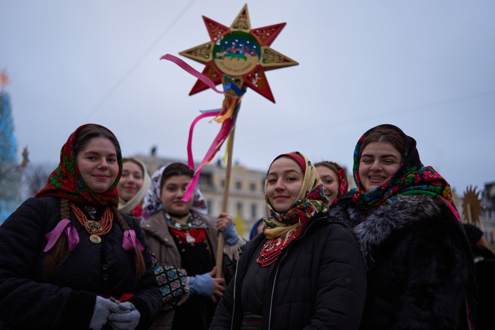 Adults stand by their side, sharing the joy.