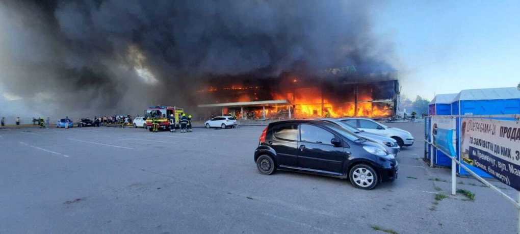Ukrainian firefighter are seen trying to put the fire out a burning shopping mall after a Russian attack in Kremenchuk, Poltava region, Ukraine on June 27, 2022. Ukrainian President Volodymyr Zelenskiy announced that Russian forces hit a shopping center in Kremenchuk, where more than 1,000 civilians are located. (Photo by Ukrainian State Emergency Service / Handout/Anadolu Agency via Getty Images)
