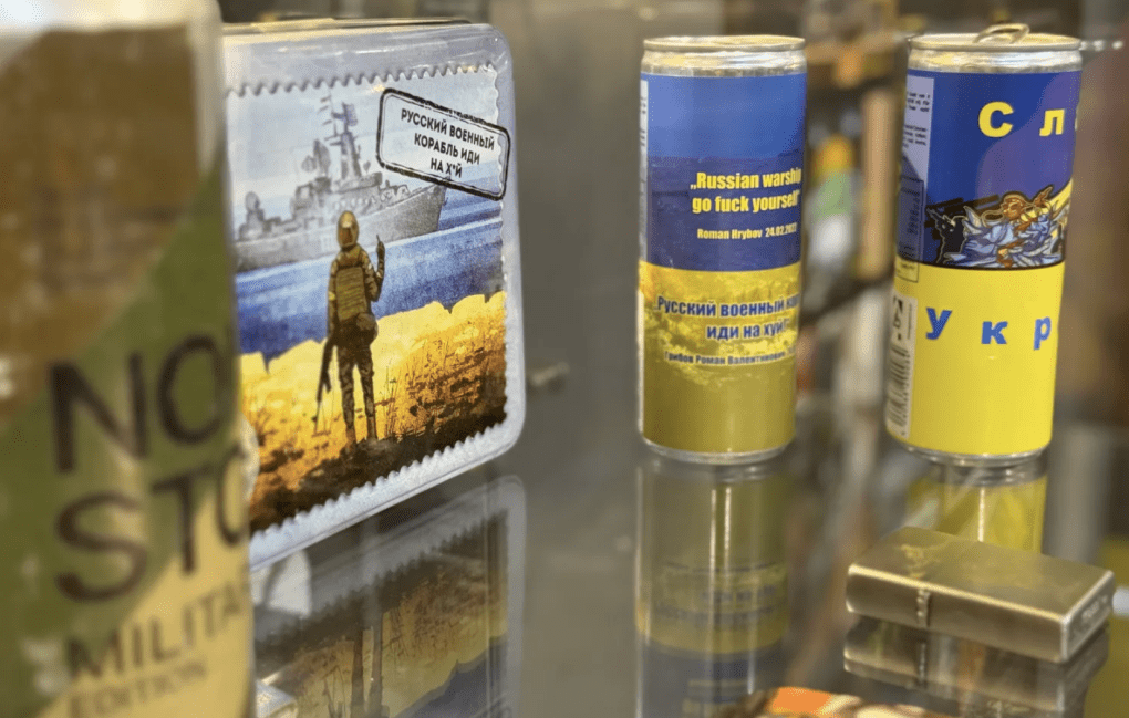 Postal stamps and commemorative items featuring the phrase “Russian warship, go f*** yourself,” referencing the defiance of Ukrainian defenders of Snake Island. (Source: Berlin Story)