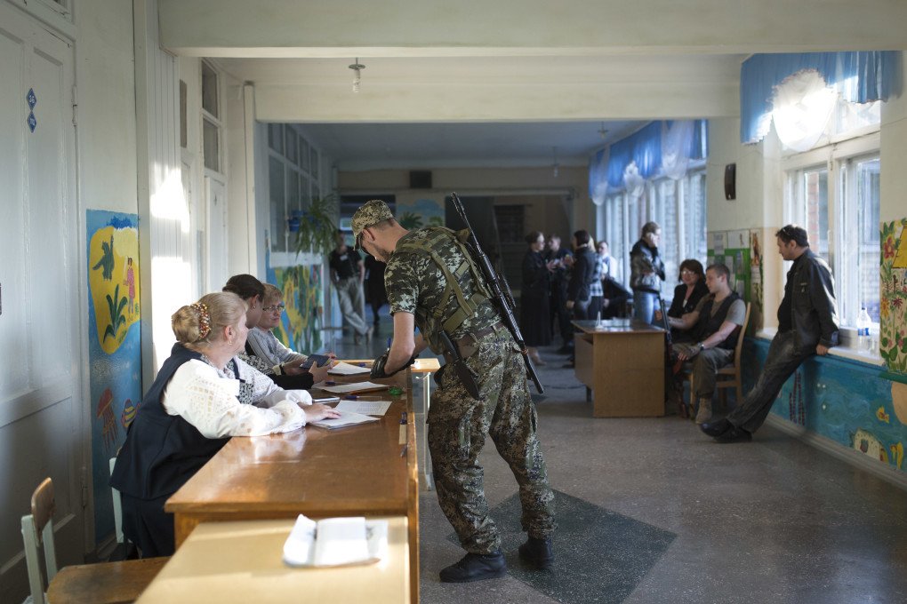 Russian-backed militants at a referendum organized by Russian proxy authorities in Kramatorsk, Ukraine's Donetsk region, in 2014. The vote was widely condemned as illegitimate. (Photo by Tali Mayer via Getty Images)