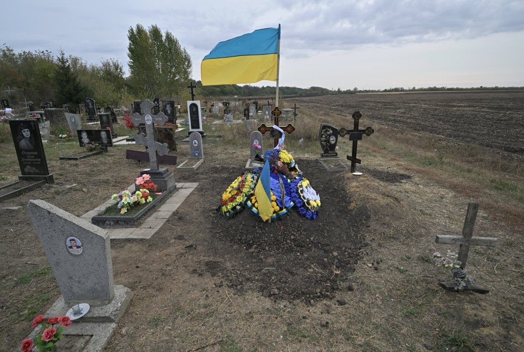 The grave of Andriy Kozyr is picture the day after he was reburied in Groza, some 30 kilometres west of Kupiansk, on October 6, 2023, amid the Russian invasion of Ukraine. (Photo by GENYA SAVILOV/AFP via Getty Images)