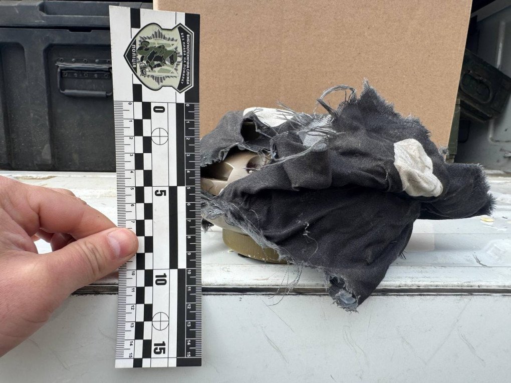 Close-up of the improvised-looking mine casing, revealing internal components beneath fabric used to conceal the device. (Source: Kherson City Military Administration) Close-up of the improvised-looking mine casing, revealing internal components beneath fabric used to conceal the device. (Source: Kherson City Military Administration)