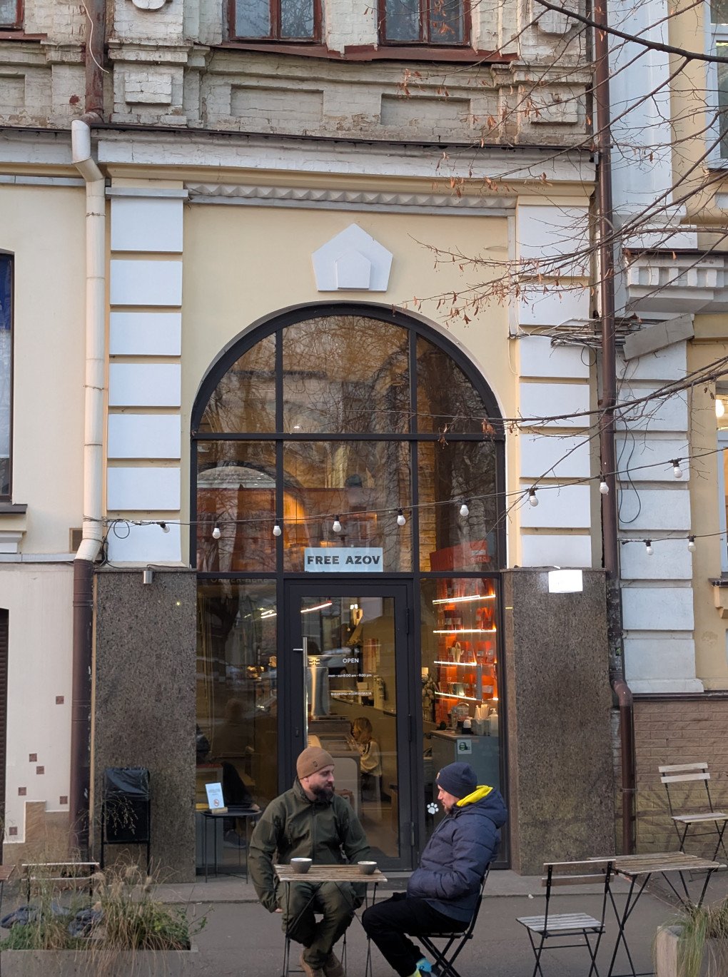 BWTC cafe with ‘Free Azov’ poster above the door, Kyiv, December 2025. Photo: Lana Faryna.