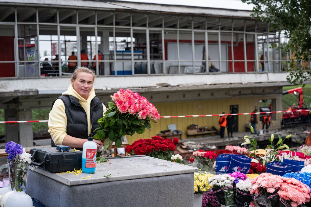 A woman sells flowers near station following the Russian attack on a metro station in Kyiv, Ukraine on October 19, 2026. (Photo by Danylo Antoniuk via Getty Images)