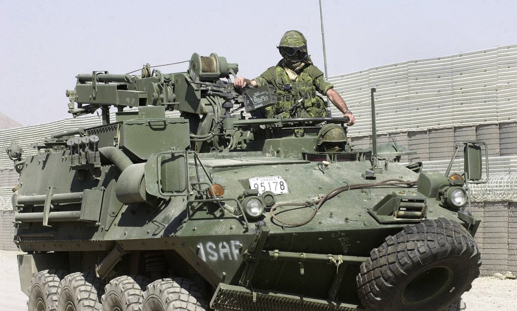 A Canadian soldier mans a gun mounted on a Bison APC as it patrols a street in the outskirts of Kabul, 03 October 2003 (Source: Getty Images) A Canadian soldier mans a gun mounted on a Bison APC as it patrols a street in the outskirts of Kabul, 03 October 2003 (Source: Getty Images)