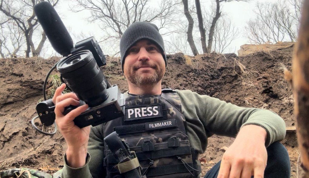 Filmmaker Xackery Irving filming in a trench along Ukraine’s frontlines. November 2024, Donetsk region. (Photo: Xackery Irving) 