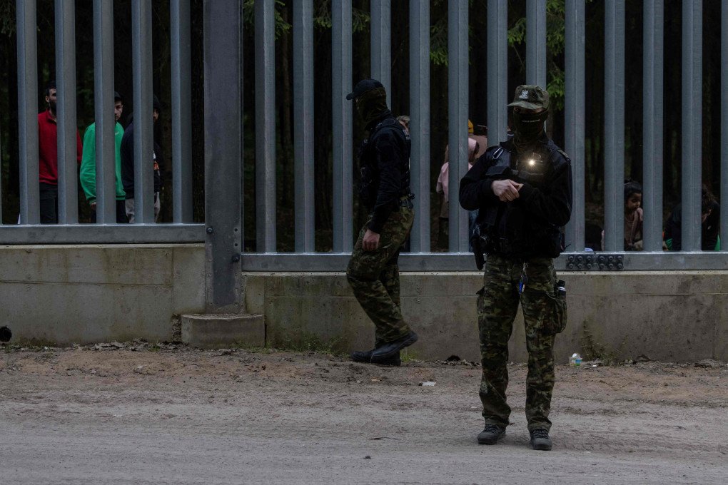 Border guards patrol along the border wall at the Polish-Belarus border not far from Bialowieza, eastern Poland, on May 29, 2023. (Source: Getty Images)