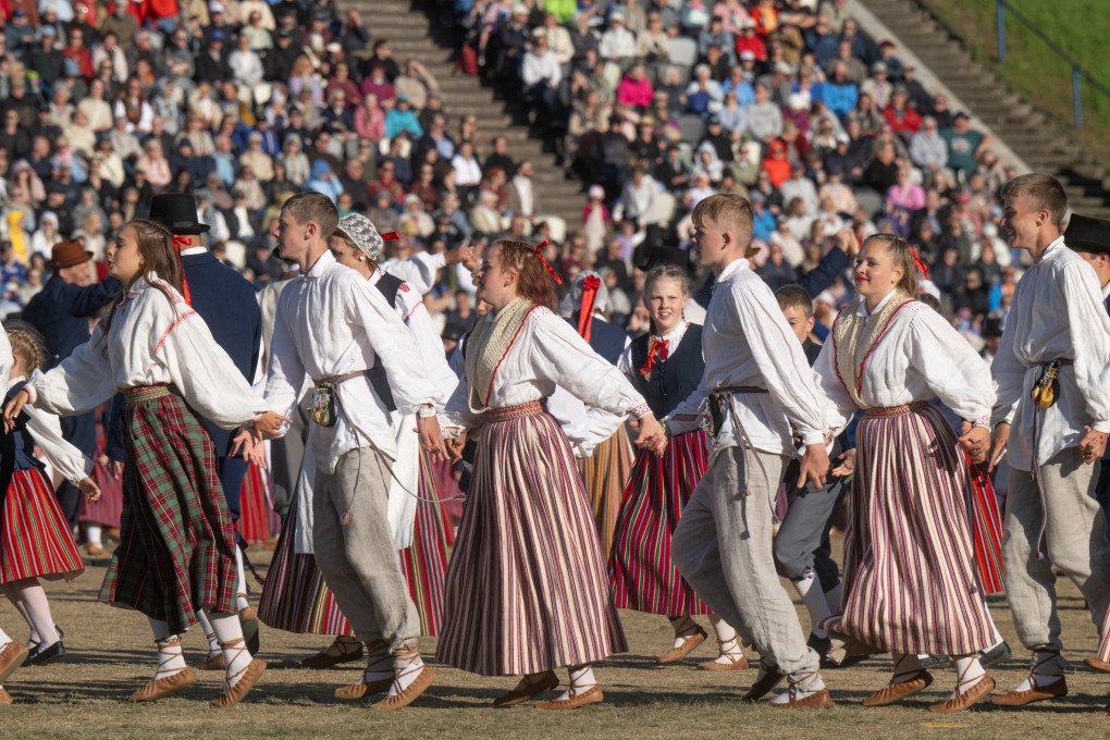 Dancers perform at the Tallinn Song Festival Grounds during the 28th Laulupidu Song and Dance Festival in Tallinn on July 4, 2025. Photo by Raigo Pajula/AFP via Getty Images.