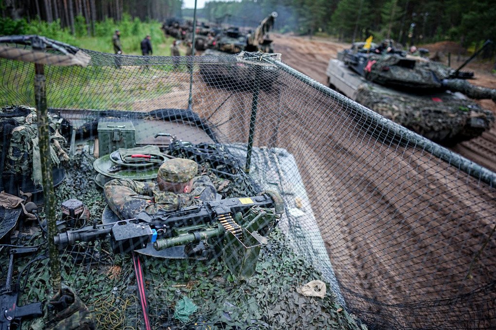 The crew of a Leopard 2 main battle tank equipped with a drone defense net waits to continue their journey during the “Freedom Shield 2026” combat exercise in Lithuania. (Source: Getty Images) The crew of a Leopard 2 main battle tank equipped with a drone defense net waits to continue their journey during the “Freedom Shield 2026” combat exercise in Lithuania. (Source: Getty Images)
