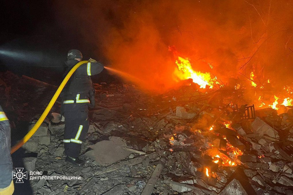 Ukrainian firefighters extinguish flames amid debris following a Russian attack in Dnipropetrovsk region. (Source: DSNS Dnipropetrovshchyny)