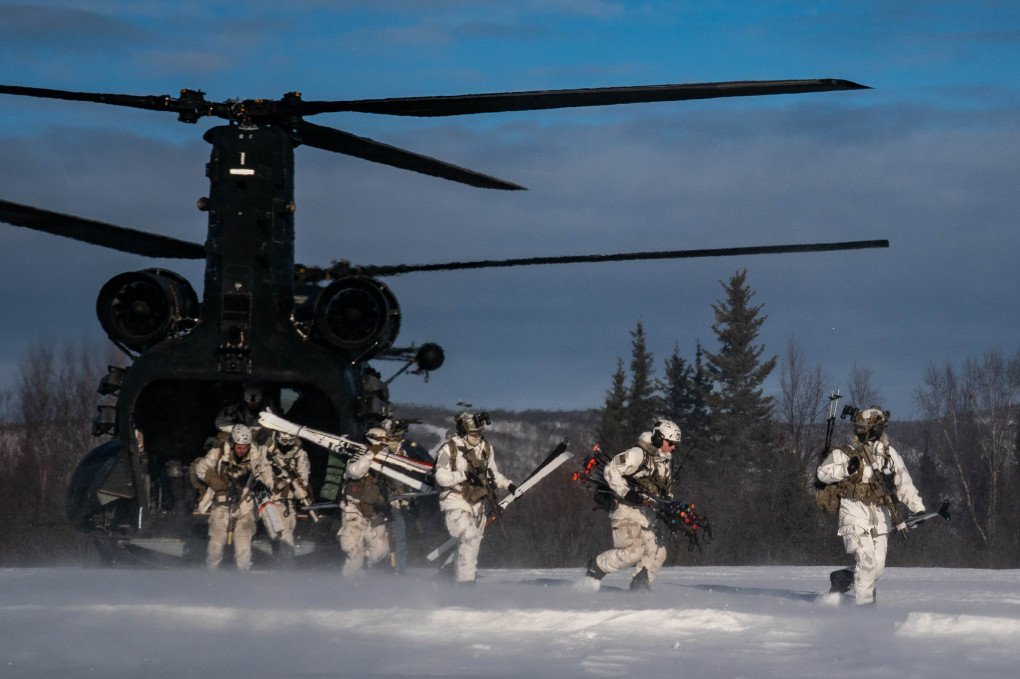 Soldiers from the 10th Special Forces Group and Danish special operators from the Jaeger Corps move through the woods to call in fire for HIMARS artillery during training at the Yukon Training Area on Fort Wainwright military base in North Pole, Alaska, on February 24, 2024. (Source: Getty Images) Soldiers from the 10th Special Forces Group and Danish special operators from the Jaeger Corps move through the woods to call in fire for HIMARS artillery during training at the Yukon Training Area on Fort Wainwright military base in North Pole, Alaska, on February 24, 2024. (Source: Getty Images)