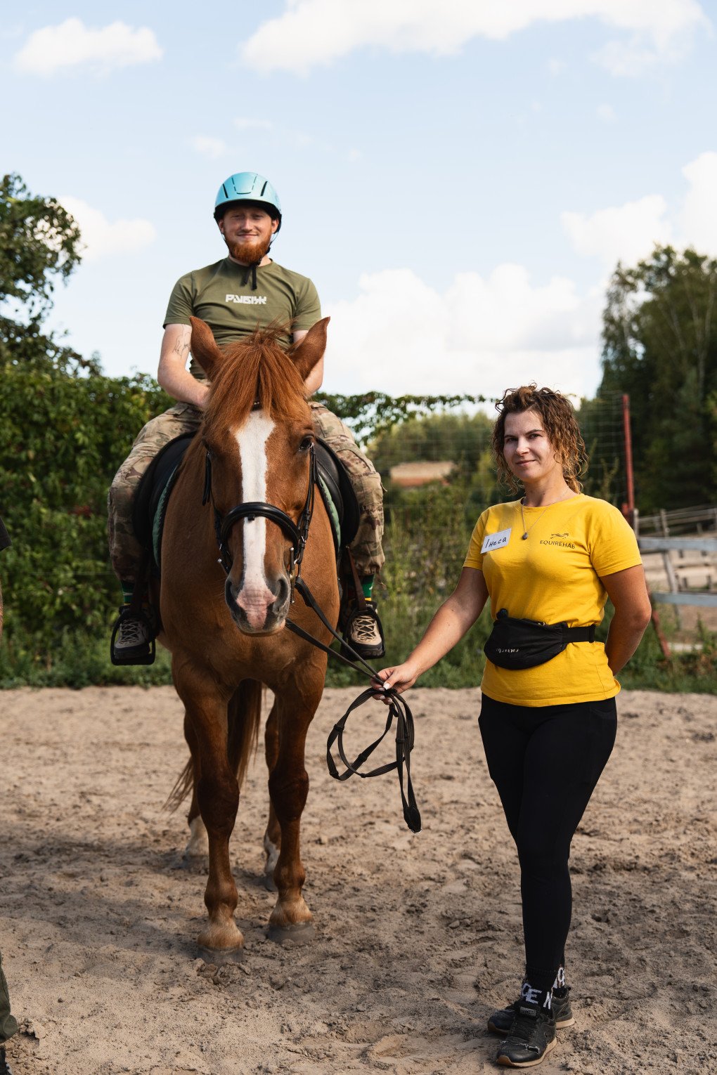Horse handler Inesa assists Zolotyy during riding exercises at Solomakha Ranch. September 2026, Kyiv region. (Photo by Nika Lastvika/EquiReHab Ukraine ) Horse handler Inesa assists Zolotyy during riding exercises at Solomakha Ranch. September 2026, Kyiv region. (Photo by Nika Lastvika/EquiReHab Ukraine )
