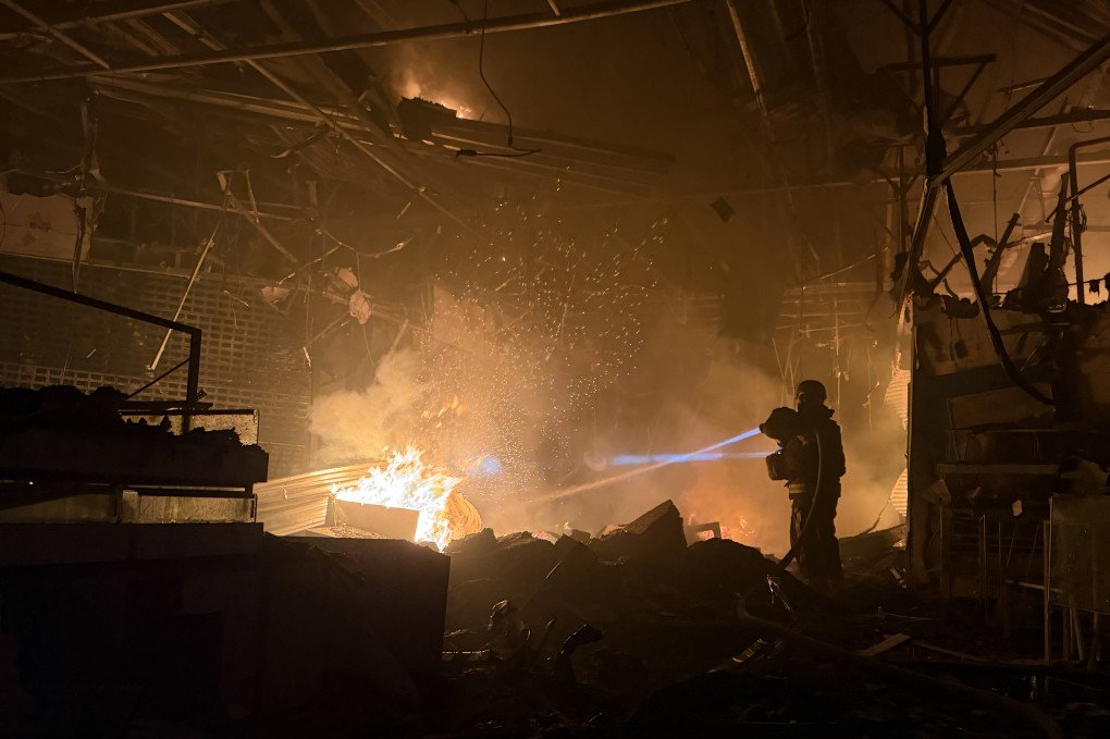 Ukrainian rescue personnel work to extinguish a fire in a damaged shopping mall following a Russian air attack in Zaporizhzhia on September 7, 2026. (Photo by Darya Nazarova via Getty Images)