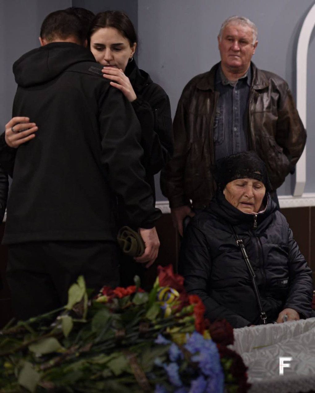 Anastasia Savova hugs someone during the funeral of her father, Oleksandr Savov. Photo by Tetiana Kreker/Frontliner Anastasia Savova hugs someone during the funeral of her father, Oleksandr Savov. Photo by Tetiana Kreker/Frontliner