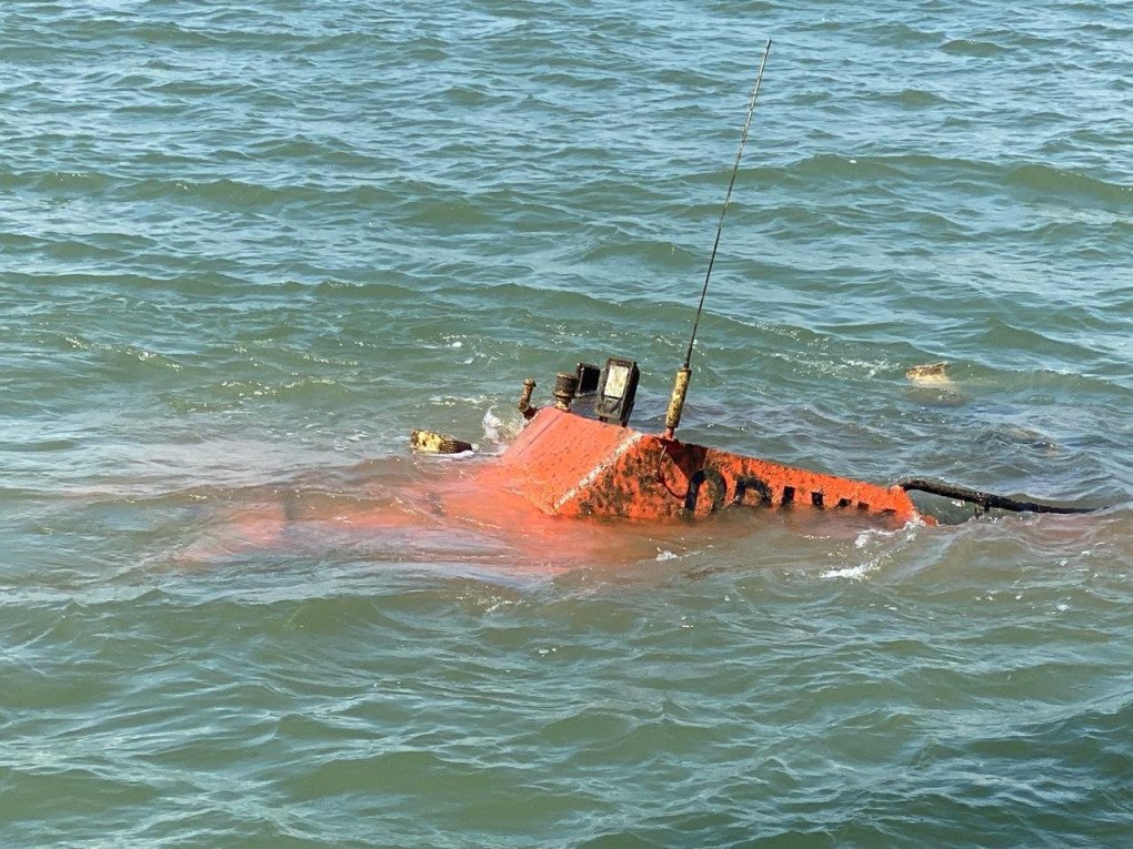A Ukrainian tugboat lies partially submerged after a Russian missile strike. Photo: Ukrainian Sea Ports Authority (USPA)