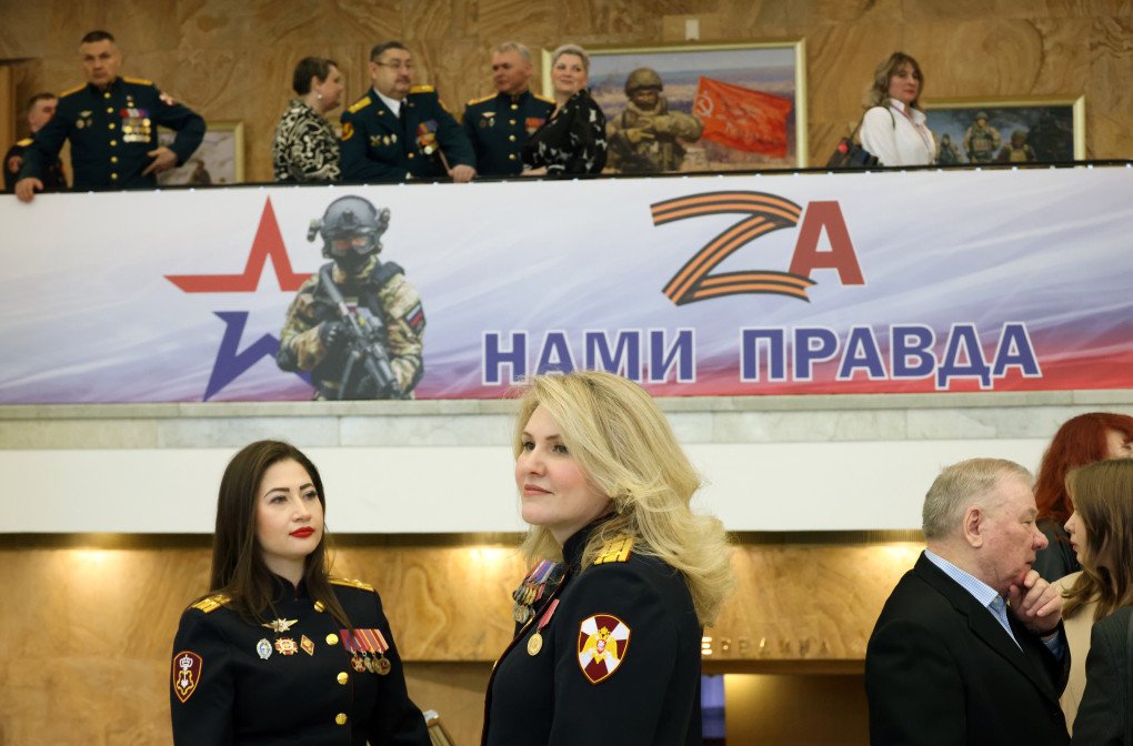 Spectators gather next to a military propaganda banner prior to the concert at the State Kremlin Palace, on March 27, 2026 in Moscow, Russia. The sign reads: "The truth is on our side". (Photo by Contributor via Getty Images)