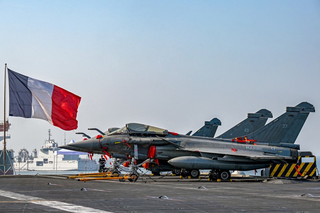 French Rafale fighter jets sit on the main deck of the nuclear-powered aircraft carrier Charles de Gaulle, during its anchor at the Mormugao Port, in Goa on January 4, 2025, as part of a joint Indo-French naval exercise Varuna. (Photo: PUNIT PARANJPE/AFP via Getty) French Rafale fighter jets sit on the main deck of the nuclear-powered aircraft carrier Charles de Gaulle, during its anchor at the Mormugao Port, in Goa on January 4, 2025, as part of a joint Indo-French naval exercise Varuna. (Photo: PUNIT PARANJPE/AFP via Getty)