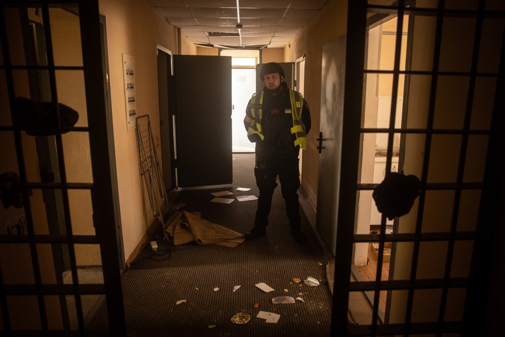 A Ukrainian police officer stands guard in the hallway of a preliminary detention centre which is believed to have been used by Russian forces to jail and torture civilians on November 16, 2022 in Kherson, Ukraine.Photo by Chris McGrath/Getty Images A Ukrainian police officer stands guard in the hallway of a preliminary detention centre which is believed to have been used by Russian forces to jail and torture civilians on November 16, 2022 in Kherson, Ukraine.Photo by Chris McGrath/Getty Images