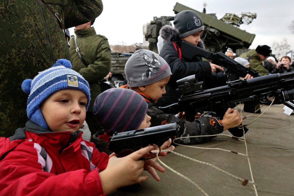 Children handle real, unloaded firearms during a Russian military recruitment campaign in Sevastopol, Ukraine, on December 20, 2014, just nine months after Moscow occupied Crimea. (Photo: Max Vetrov via Getty Images) Children handle real, unloaded firearms during a Russian military recruitment campaign in Sevastopol, Ukraine, on December 20, 2014, just nine months after Moscow occupied Crimea. (Photo: Max Vetrov via Getty Images)