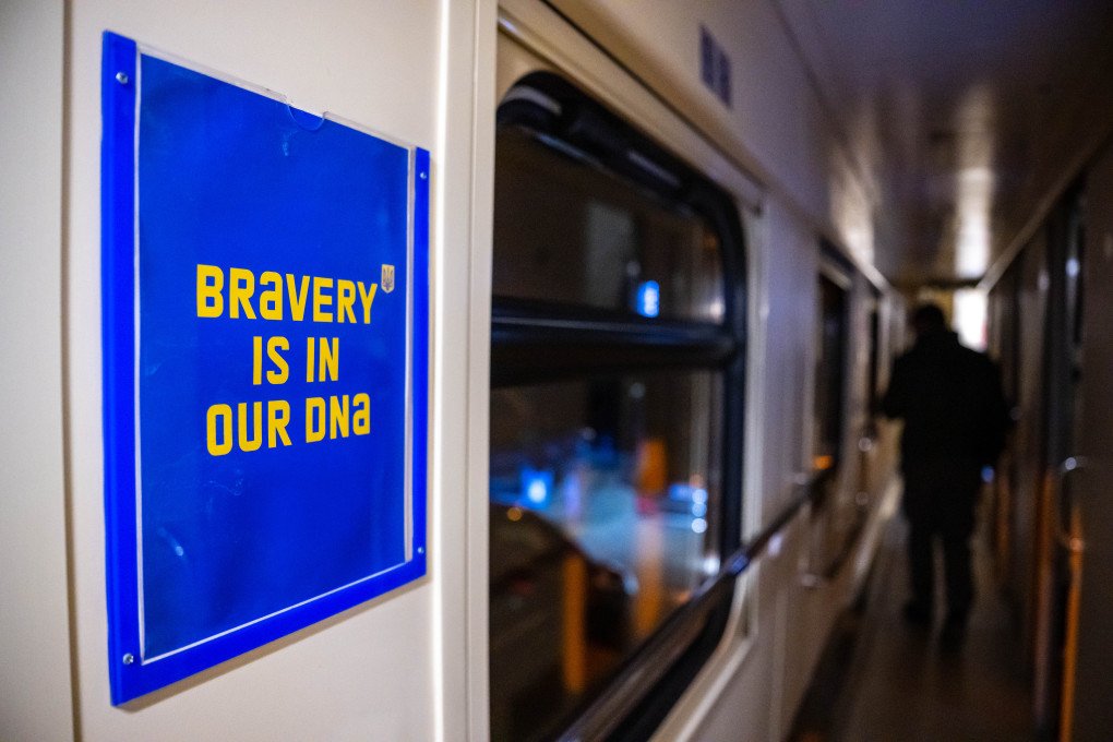 "Bravery is in our DNA" is written on a poster on the night train on the way to Kiev. (Photo by Sina Schuldt/picture alliance via Getty Images)