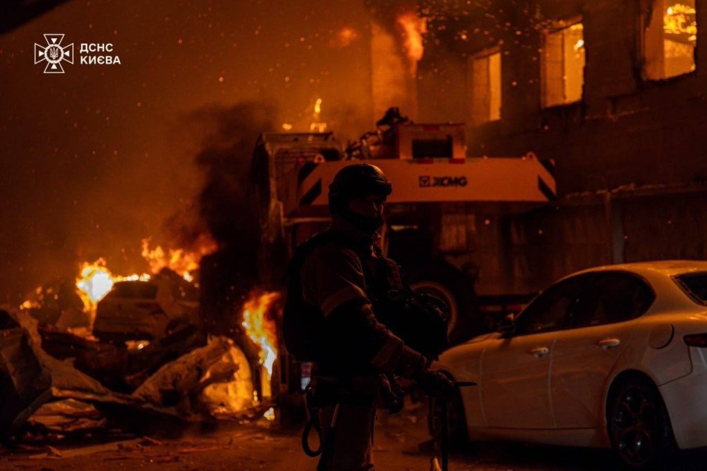 A firefighter stands near burning vehicles and structures at night as emergency crews respond to the aftermath of a Russian ballistic missile attack on Kyiv. (Source: State Emergency Service of Ukraine) A firefighter stands near burning vehicles and structures at night as emergency crews respond to the aftermath of a Russian ballistic missile attack on Kyiv. (Source: State Emergency Service of Ukraine)