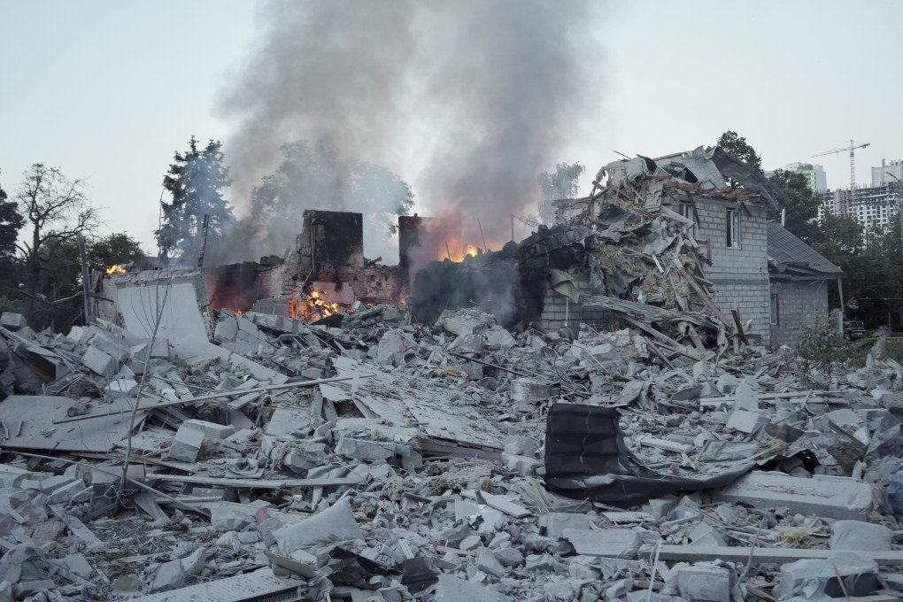 A firefighter searches through heavy structural debris inside a damaged apartment building to locate trapped residents. (Source: Lucile Brizard/UNITED24 Media) A firefighter searches through heavy structural debris inside a damaged apartment building to locate trapped residents. (Source: Lucile Brizard/UNITED24 Media)