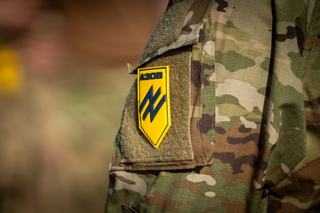 Azov brigade shoulder sleeve patch is seen on a shoulder of a serviceman during ‘Free Azov’ rally on the anniversary of Olenivka prison massacre. (Photo by Oleksii Samsonov via Getty Images)