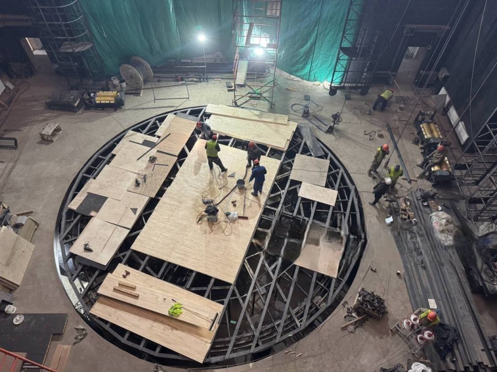 Workers assemble a circular stage platform during the interior reconstruction of the Mariupol Drama Theatre. (Source: Telegram / Mariupol City Council) Workers assemble a circular stage platform during the interior reconstruction of the Mariupol Drama Theatre. (Source: Telegram / Mariupol City Council)