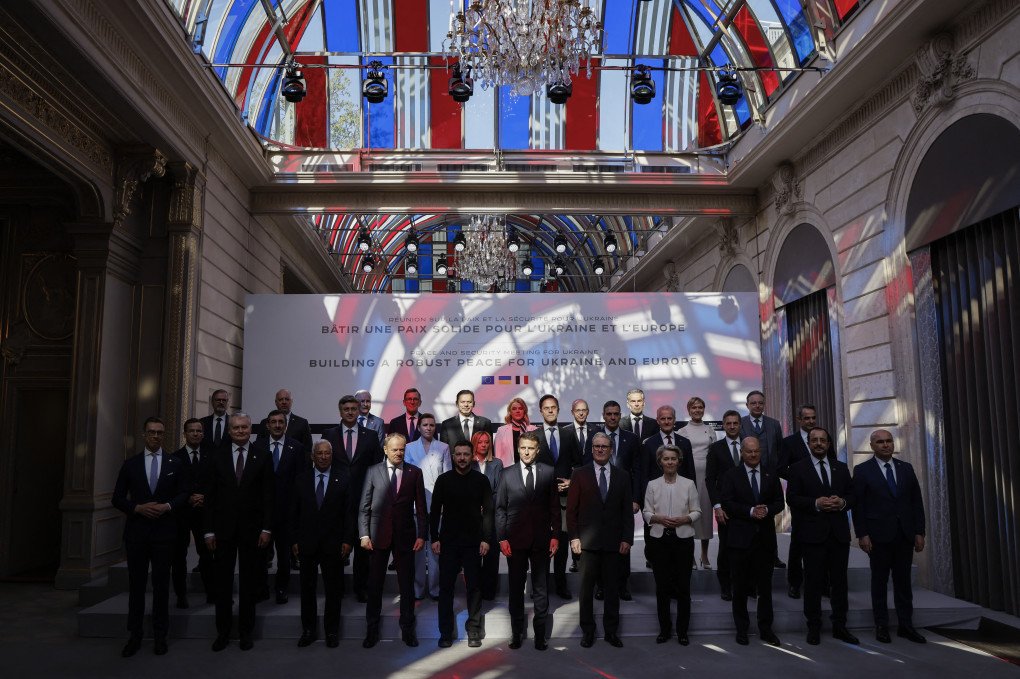 Officials pose for a family picture during a meeting as part of a summit for "coalition of the willing" at the Elysee Palace, in Paris, on March 27, 2025. French President Emmanuel Macron on March 27, 2025 is to host European leaders including President Volodymyr Zelenskyy for a summit aimed at boosting Ukrainian security ahead of any potential ceasefire with Russia. (Photo by LUDOVIC MARIN/POOL/AFP via Getty Images)