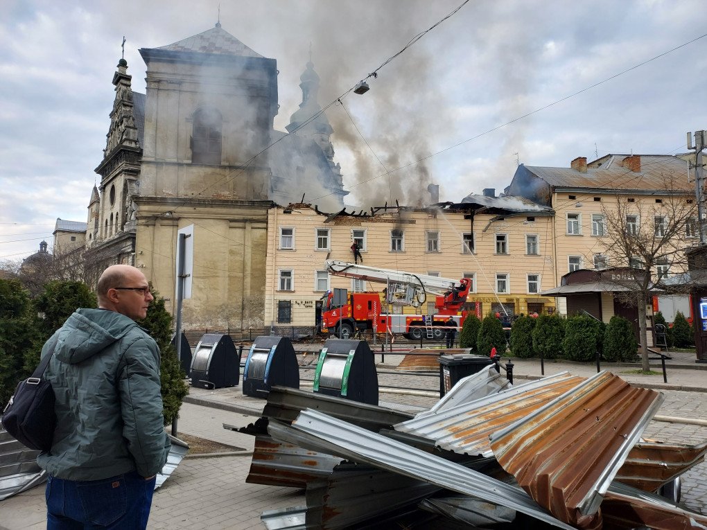 Firefighters extinguish a fire on building in center of city after Russian drone attack on March 24, 2026 in Lviv, Ukraine. (Source: Getty Images)