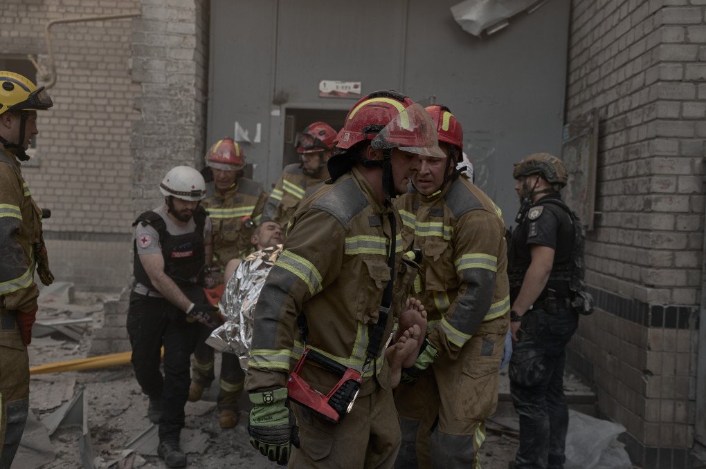 Rescue workers carry an injured resident at the site of a destroyed section of a residential building after an explosion caused by a Russian strike during an overnight missile and drone attack on July 2, 2026 in Kyiv, Ukraine. People were believed to be trapped under the rubble. (Photo by Kostiantyn Liberov/Libkos/Getty Images)