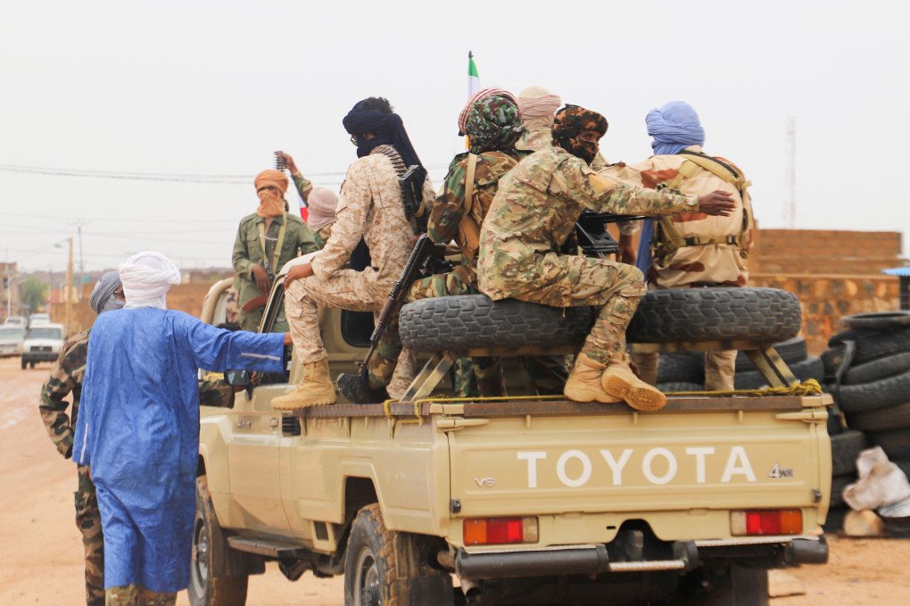 Fighters for Coordination of Azawad Movements (CMA) patrol through town during the Congress for the Fusion of Movements in Kidal. (Photo by SOULEYMANE via Getty Images)
