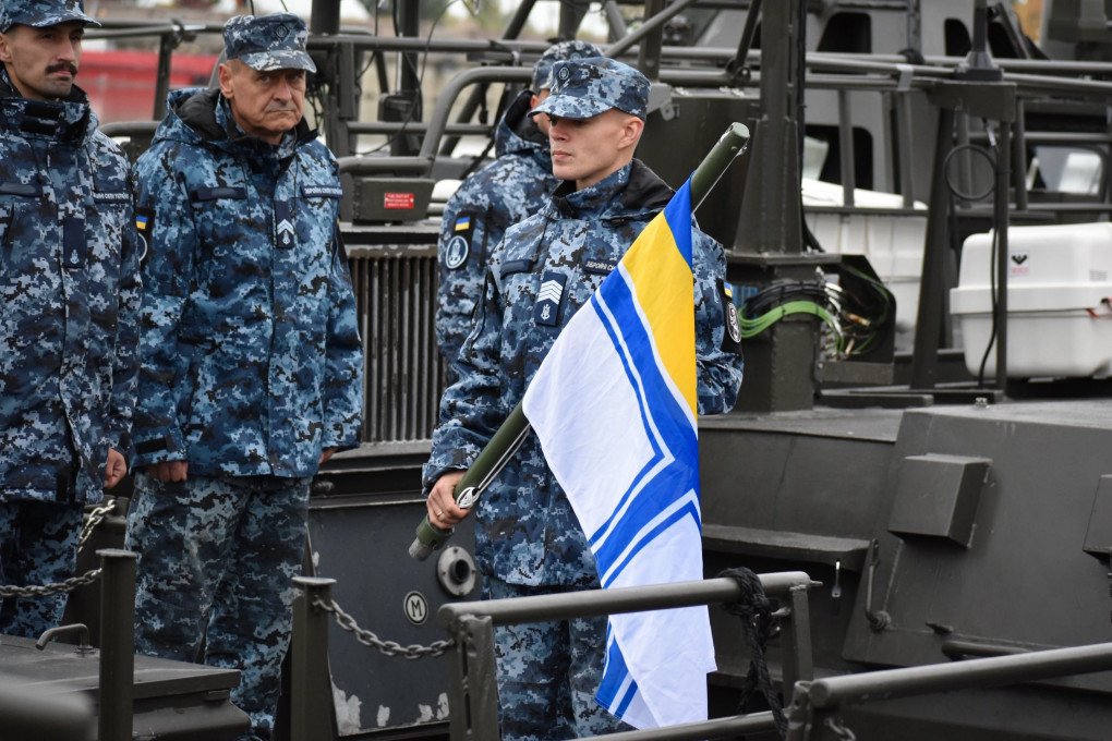 Ukrainian naval personnel stand on the deck of a CB90 boat during a flag ceremony. (Source: Ukrainian Navy) Ukrainian naval personnel stand on the deck of a CB90 boat during a flag ceremony. (Source: Ukrainian Navy)