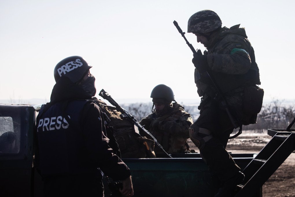 A member of the press speaks with Ukrainian military personnel before departing on a combat mission toward the Bakhmut direction on February 8, 2023, in Donetsk region, Ukraine. (Photo: Yevhenii Zavhorodnii/Global Images Ukraine via Getty Images) Ukrainian troops shotgun