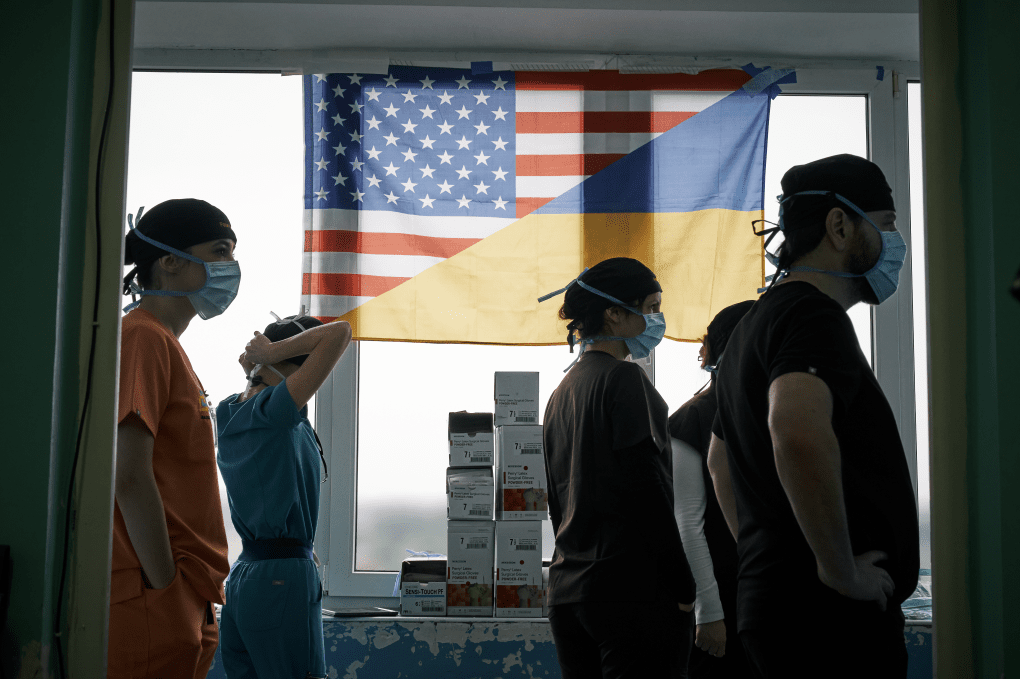 American and Ukrainian surgeons stand side by side before surgery in Lviv. Photo: Josh Olley American and Ukrainian surgeons stand side by side before surgery in Lviv. Photo: Josh Olley