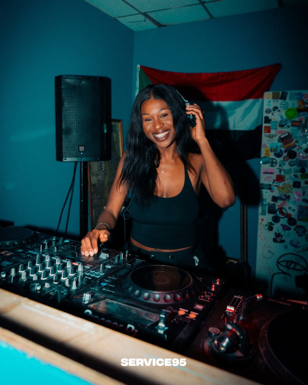 DJs igniting the dance floor, creating an electrifying atmosphere at the Service95 charity event in support of Ukraine