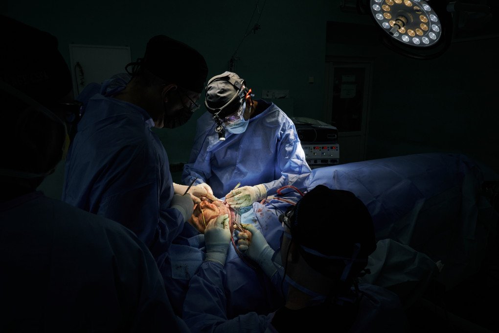 A team of American and Ukrainian surgeons performs complex facial reconstruction on a wounded soldier. Photo: Josh Olley