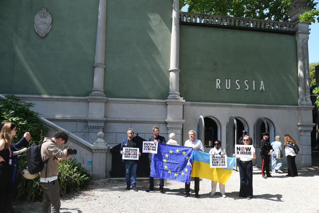 Protesters in front of the Russian pavilion on the grounds of the 2026 Art Biennale on the opening day of the event commemorate Russia's four-year war of aggression against Ukraine. (Photo by Felix Hörhager via Getty Images Protesters in front of the Russian pavilion on the grounds of the 2026 Art Biennale on the opening day of the event commemorate Russia's four-year war of aggression against Ukraine. (Photo by Felix Hörhager via Getty Images