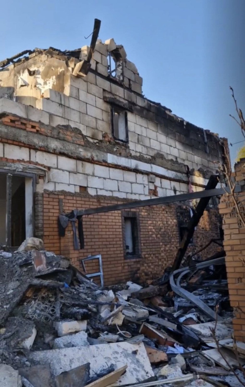 The exterior of Beskrestnov’s home shows massive structural damage, with a collapsed roof, blown-out windows, and severe fire damage following the April 20 attack. (Source: Serhiy “Flash” Beskrestnov)