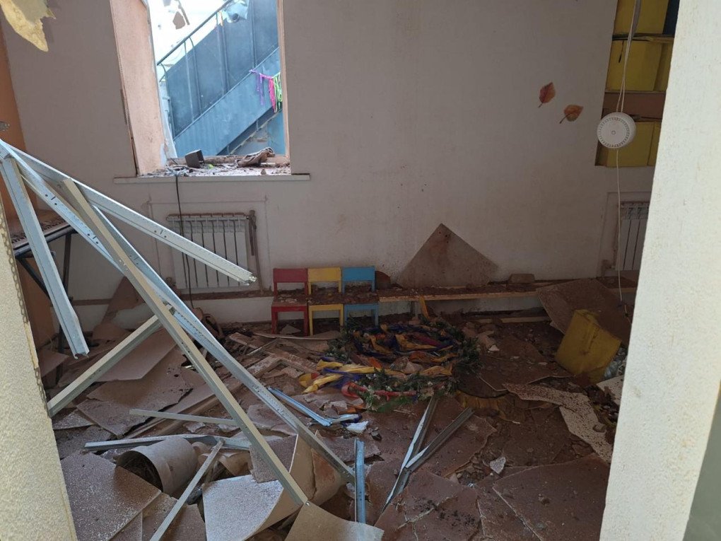 A classroom left in ruins following the strike. Debris and children’s chairs are scattered across the floor. (Source: SBU)