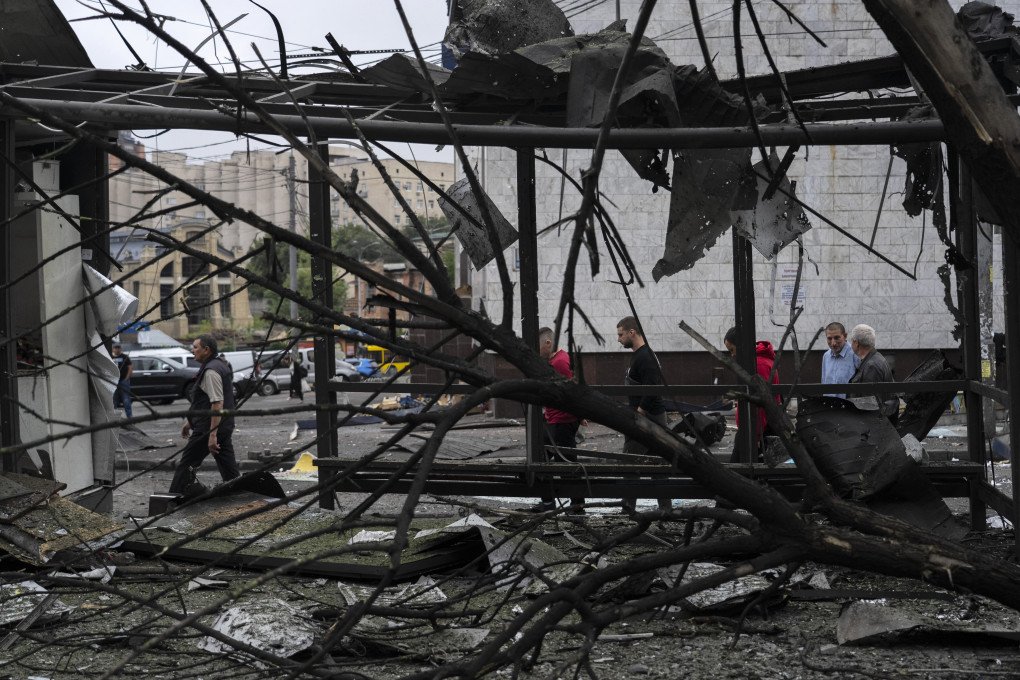 People walk past wreckage near a metro station following a Russian attack in Kyiv on July 21, 2025. (Source: Getty Images) People walk past wreckage near a metro station following a Russian attack in Kyiv on July 21, 2025. (Source: Getty Images)