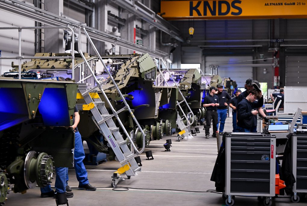 KNDS employees work on the vehicles during the opening of the new production line for the highly protected 8x8 wheeled vehicle "BOXER" from KNDS, April 22, 2026, Bavaria, Munich.