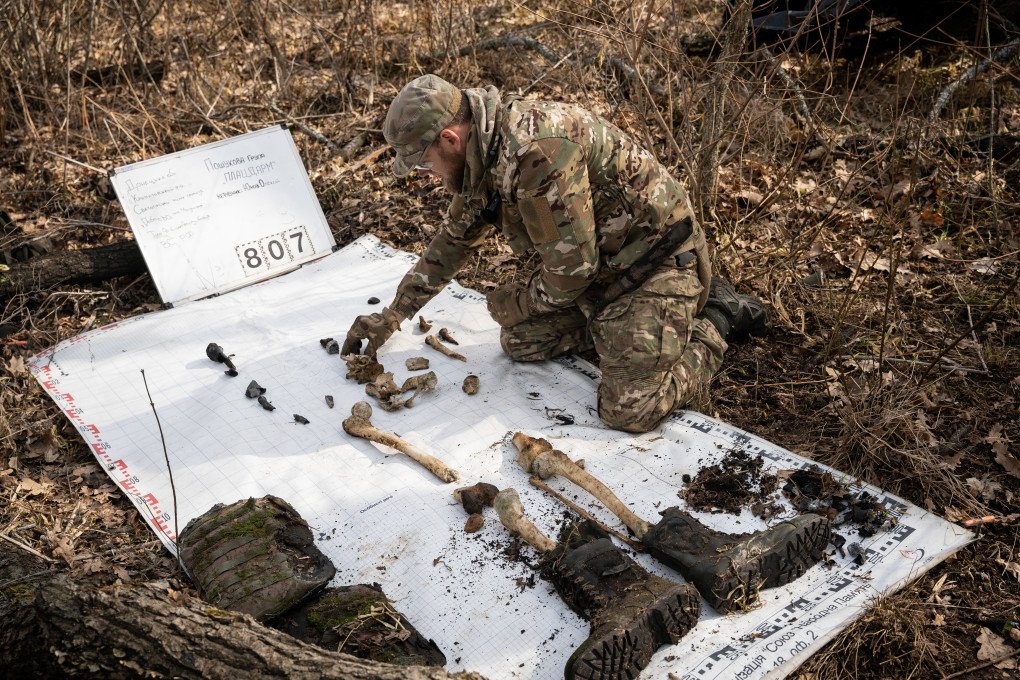 Oleksiy Yukov, founder of the Ukrainian organization Platsdarm, collects the mortal remains of a fallen Russian soldier in Donetsk Oblast, Ukraine, on March 11, 2025. (Photo: Alfons Cabrera/NurPhoto via Getty Images)