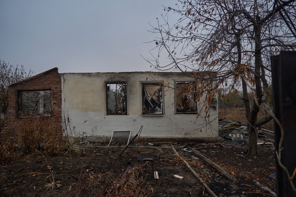 A burned house after being hit by a Russian shell. A burned house after being hit by a Russian shell.