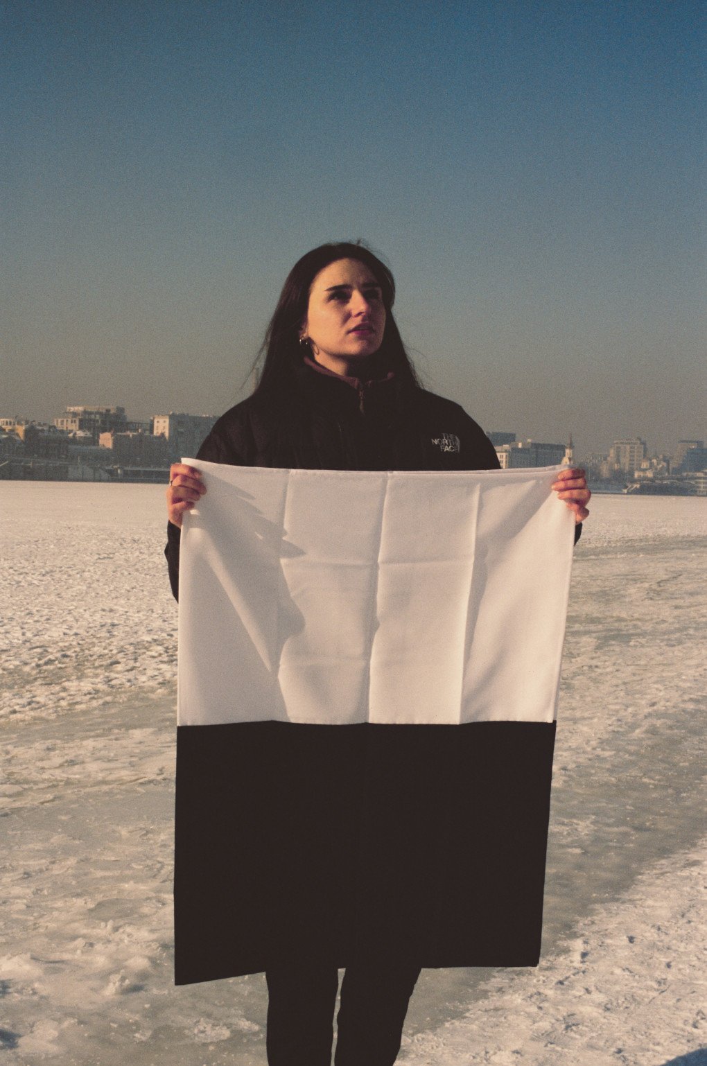 Anastasia Savova holds the Flag of Hope, the national symbol of memory and support for prisoners of war and the missing. January, 2026, Kyiv, Ukraine. Photo by Amira Barkhush/UNITED24 Media. Anastasia Savova holds the Flag of Hope, the national symbol of memory and support for prisoners of war and the missing. January, 2026, Kyiv, Ukraine. Photo by Amira Barkhush/UNITED24 Media.