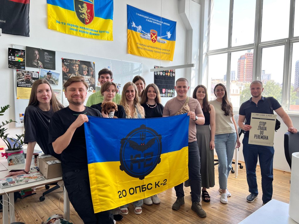 The K-2 Brigade visit the Lobby X office and present the team with their unit’s flag. (Source: Lobby X)