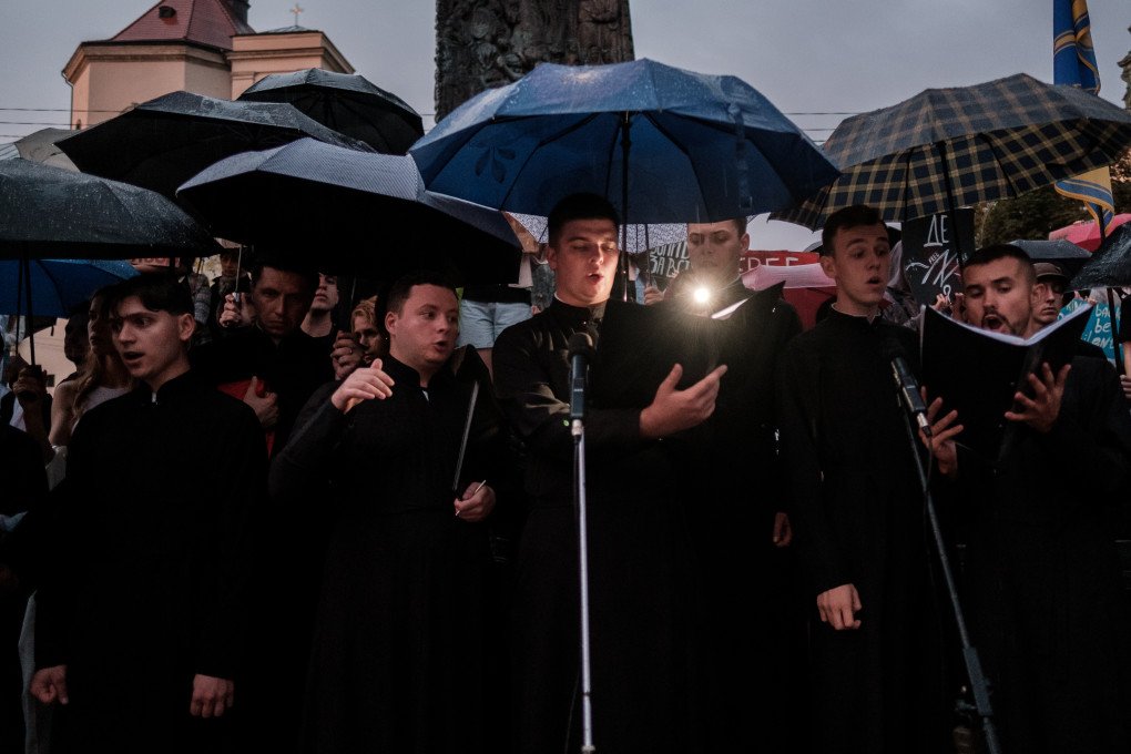 LVIV, UKRAINE - JULY 28, 2024: During a "Free Azov" rally in Lviv, Ukraine, priests lead a prayer honoring the memory of Ukrainian prisoners of war who were killed in a Russian attack on Olenivka prison. The event traces back to the night of July 29, 2022, when at least 54 Ukrainian servicemen taken captive from Azovstal  to a Russian-occupied penal colony in Olenivka, Donetsk Oblast, were killed by Russia in an attack. The "Free Azov" rallies, held across Ukrainian cities, unite activists and relatives of many POWs to raise awareness and demand justice for the defenders of Mariupol, many of whom have been in Russian captivity for over two years.  (Photo by Les Kasyanov/Global Images Ukraine via Getty Images).